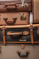 Wall Mural - Old, retro, suitcases lie on the table with white background