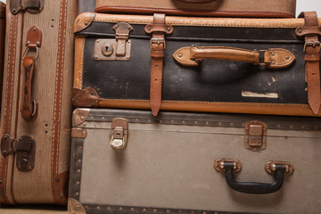 Wall Mural - Old, retro, suitcases lie on the table with white background