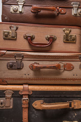 Wall Mural - Old, retro, suitcases lie on the table with white background