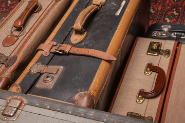 Wall Mural - Old, retro, suitcases lie on the table with white background