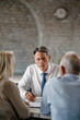 © Drazen - Insurance agent and his senior clients going through financial reports on a meeting,