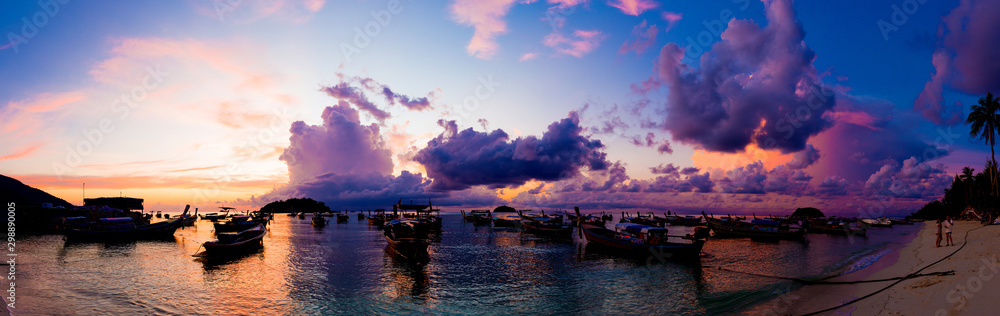 Panorama view of sunrise morning beach with boat sky cloud - obrazy, fototapety, plakaty 