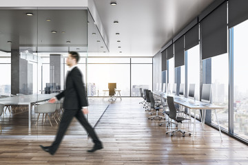 Sticker - Businessman in modern concrete office interior