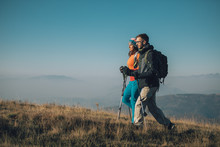 Couple Hikers On A Mountaintop