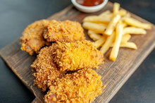 Fried Chicken With French Fries And Food Nuggets - On Stone Background