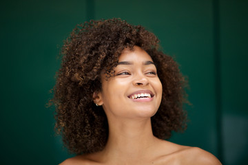 Wall Mural - close up beautiful young african american woman smiling and looking away