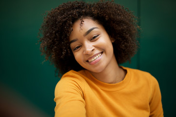 Wall Mural - beautiful african american woman taking selfie