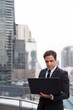 © Ranta Images - Handsome Persian businessman against view of the city