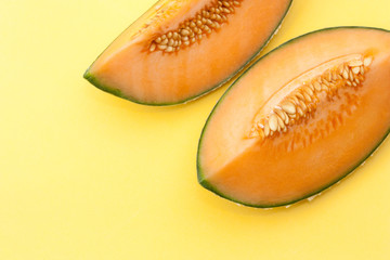 Wall Mural - ripe melon on yellow background