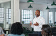 © mavoimages - Smiling African American businessman having a meeting with his team