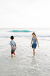 © KCULP - Brother and Sister Playing on the Beach
