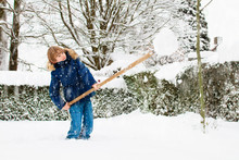 Child Shoveling Winter Snow. Kids Clear Driveway.