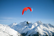 Two Skiers With Paraglider Is Flying Above Mountains