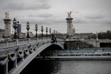 Fototapeta Paryż - Pont Alexandre III across Seine river in Paris