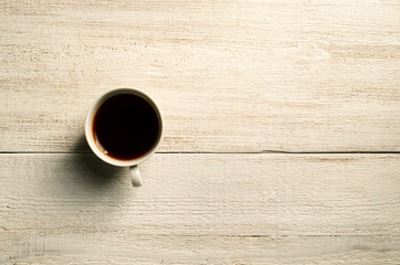 coffee cup on wood table with space. Top view