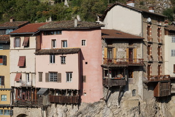 Wall Mural - old stone colorful houses with hanging decks  above the river in France