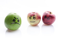 Face Painted Apples. Jolly And Sad Funny Apples. Green And Red Apples On A White Background.