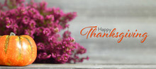 Happy Thanksgiving. Thanksgiving Pumpkin And Autumn Flowers On Wooden Background