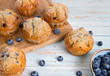 blueberry muffins on wooden table