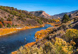 Beautiful autumn colors with fly fishermen on Rio Grande river flowing through New Mexico	