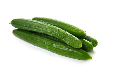 Wall Mural - green long cucumbers on a white background