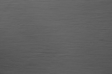 Dark grey cement wall with rustic natural brush stroke texture for abstract background and design purpose