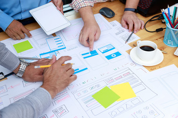 Wall Mural - graphic designers work together with ux ui designer planning application template layout framework f
