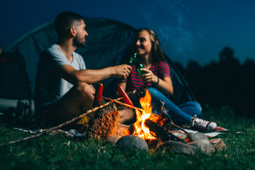 Wall Mural - friends on night camping by the camping fire