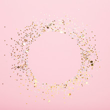 Round Copy Space Of Gold Confetti On Pink Background