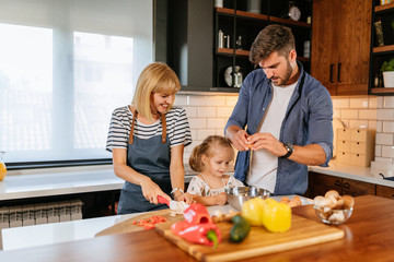 Wall Mural - Learning how to cook with parents