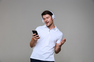 Poster - Emotional man listening music with headphones