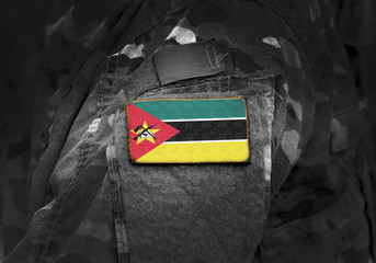 Wall Mural - Flag of Mozambique  on military uniform. Army, troops, soldiers. Collage.