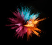 Explosion Of Colored Powder Isolated On Black Background