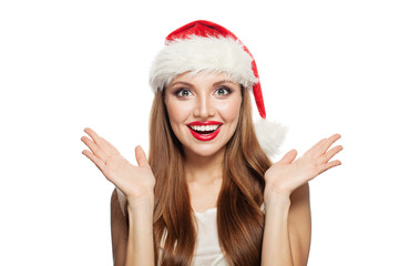  Christmas woman wearing Santa hat isolated on white. Happy surprised model girl