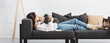© LIGHTFIELD STUDIOS - attractive woman lying on sofa with scottish fold cat in cozy living room