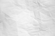 © ooddysmile - white and gray wide crumpled paper texture background. crush paper so that it becomes creased and wrinkled.