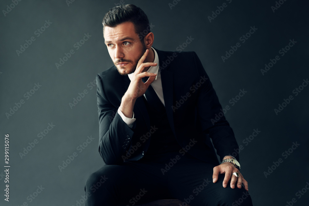 Elegant young man portrait on black background - obrazy, fototapety, plakaty 