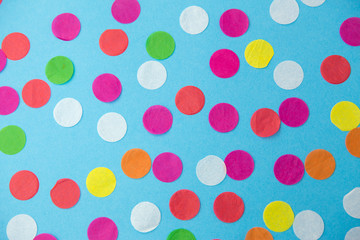 Wall Mural - party, celebration and decoration concept - colorful confetti on blue background