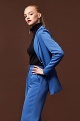 Wall Mural - Beautiful sexy woman wear for meeting date business style suit jacket pants accessory fashion collection shoes model pose long blond hair natural make up businesswoman casual clothes.