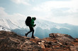 © Ivan Kmit - Amazing landscape with snowy mountains range and backpacker with backpack on a foreground