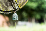Fototapeta Zwierzęta - small metal bell with blur background