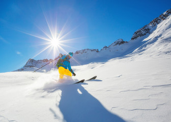 Canvas Print - Freerider skier running downhill