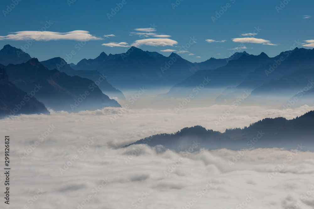 sea of fog over Schwyz and Uri in Swiss mountains with blue sky - obrazy, fototapety, plakaty 