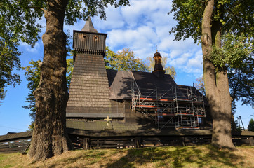 Wall Mural - Wooden church dedicated to Saint Bartholomew (Bartlomiej) in Poręba Wielka village, Poland. Built in the early sixteenth century in the Gothic style.