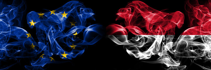 Eu, European union vs Monaco, Monacan smoke flags placed side by side. Thick colored silky smokes abstract flags