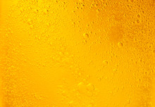 Bubbles On Beer Background. Oil Drop Shape On Yellow Background.Golden Circle Bubble Water Pattern.