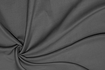 Black Cloth background with soft waves.