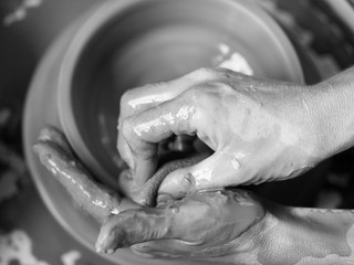 Making Ceramic Molds: Hands molding pottery. Mugs made of clay