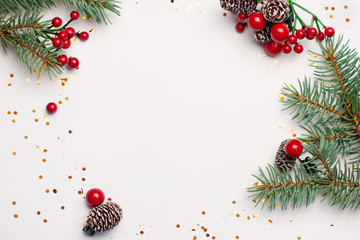 Wall Mural - christmas composition flatlay. spruce branches, red berries on white background with space for text