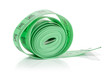 One whole haberdashery item green tape isolated on white background